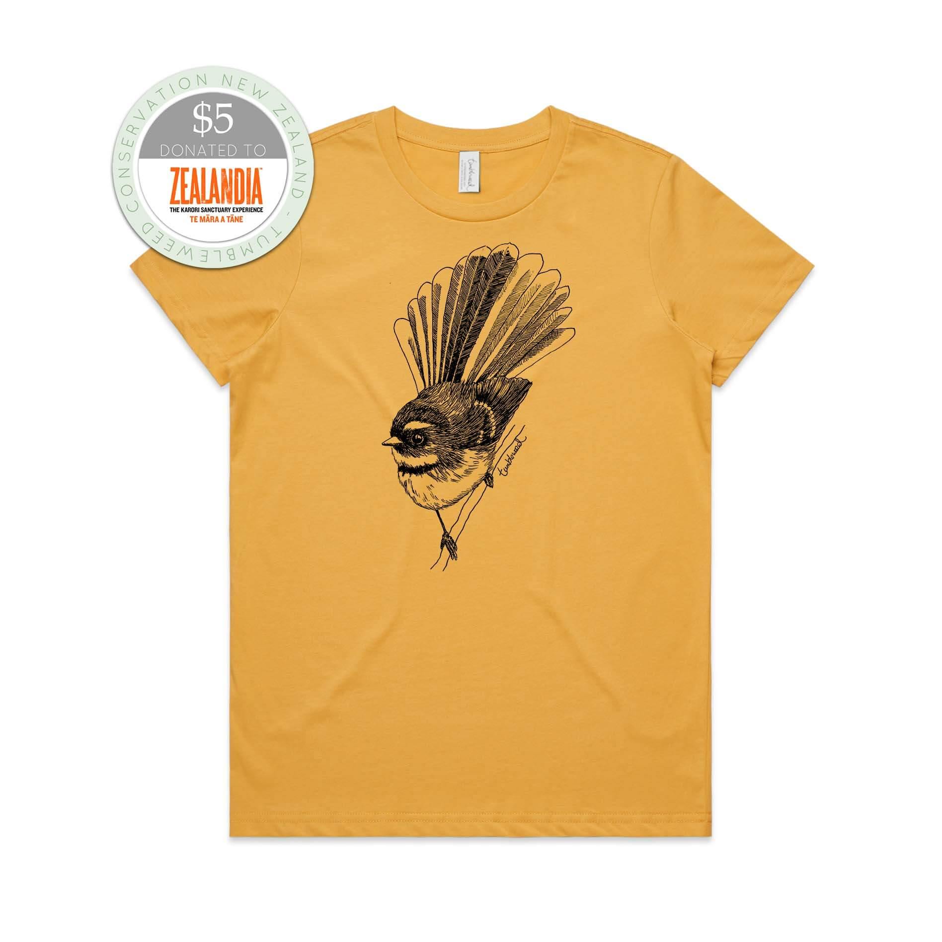 Mustard, female t-shirt featuring a screen printed black Fantail/Pīwakawaka design.