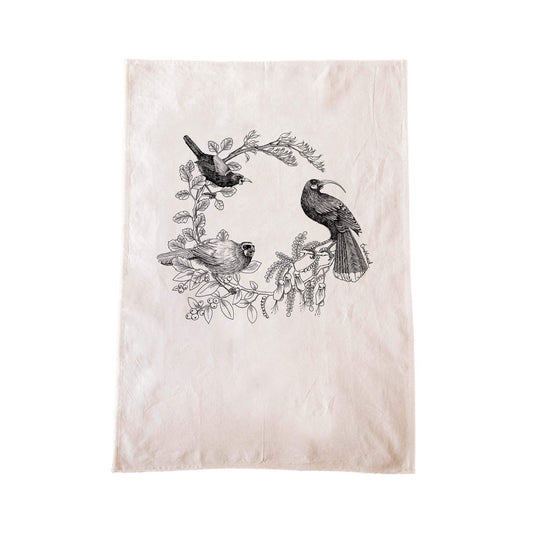 Off-white cotton tea towel with a screen printed Kokako huia saddleback/tieke design.