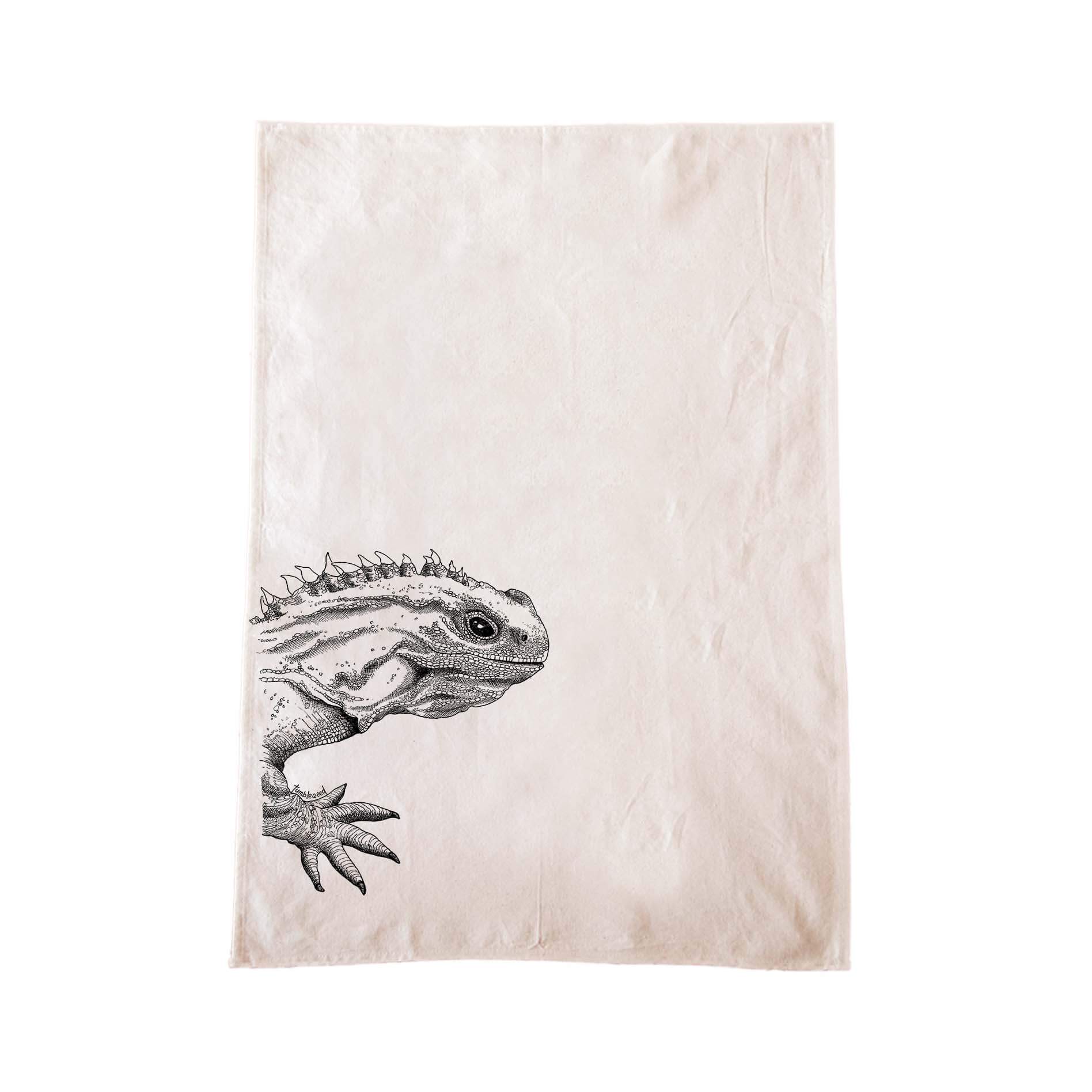Off-white cotton tea towel with a screen printed Tuatara design.